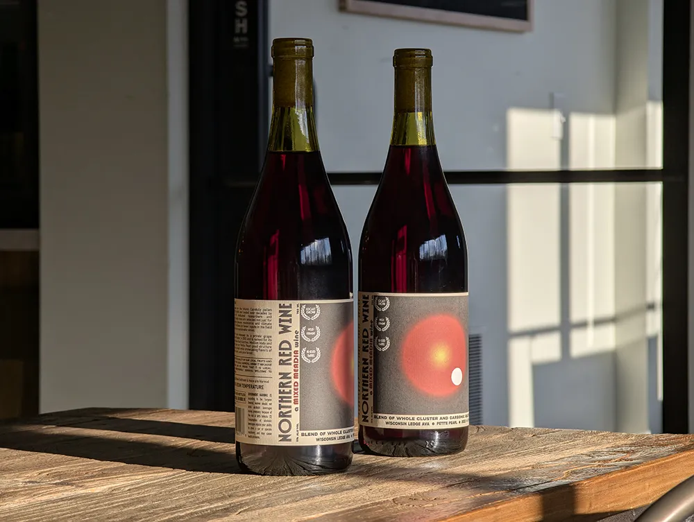 mmw page 1 Group of two Hatch Distilling red wine bottles